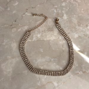 Gold and faux diamond choker.